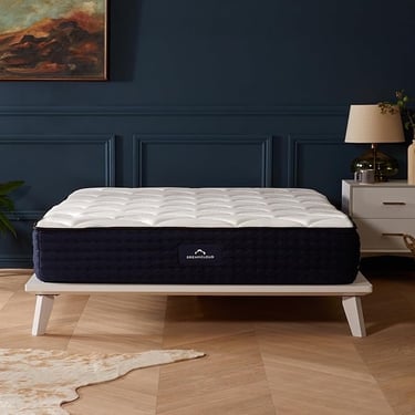 a mattress that is sitting on a wooden floor