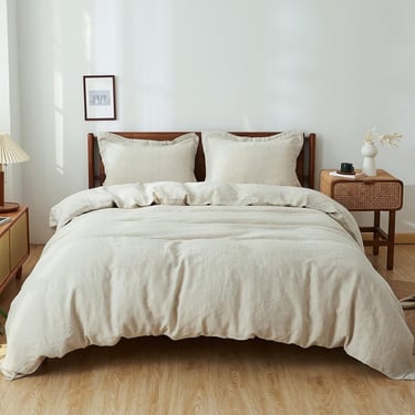a bed with a white bed and a lamp