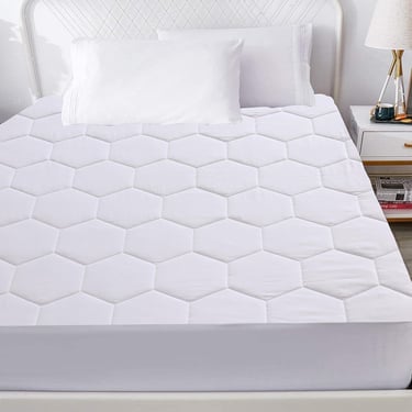 a bed with a white bed and a white bed