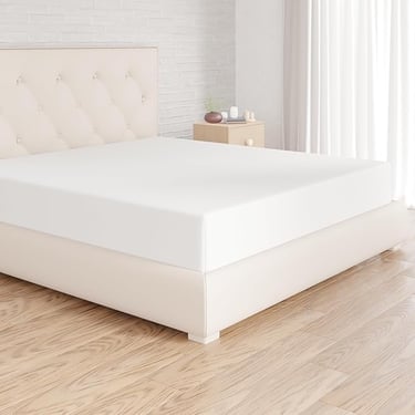 a bed with a white bed and a white bed