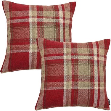 a pair of pillows with a red and beige plaid pattern
