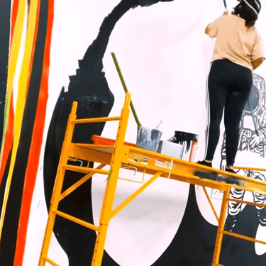 Kamile painting giant mural