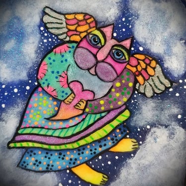 A rock painting of a fairy kitty in bright colors using Laurel Burches art style..