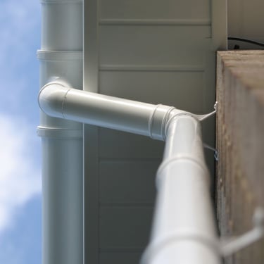White PVC guttering, downpipe and fascia