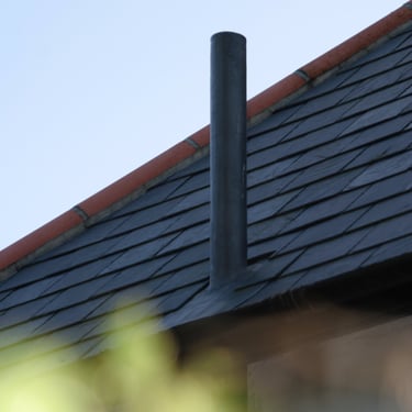 Slate roof with custom-made lead slate flue