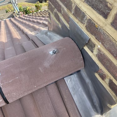 Redland BMI dry ridge tile butted against lead flashing