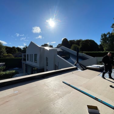EPDM rubber roof installation on modern white house