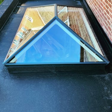 Lantern roof light installation on flat felt roof