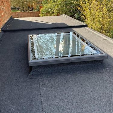 Vellux roof light on flat felt torch on roof