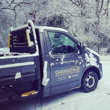 Goodchild Roofing VW transporter pick up in a snowy scene