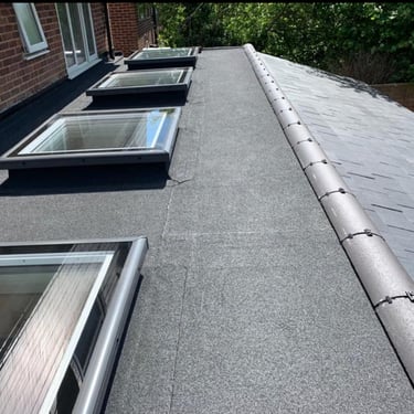 Installation of four Vellux roof lights on felt roof dry ridge system