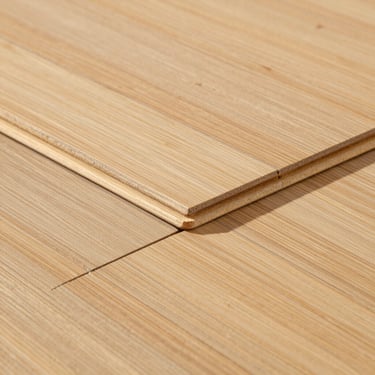 Close-up of interlocking sustainable bamboo flooring tiles, showing natural fiber textures and precise joints, bright natural light