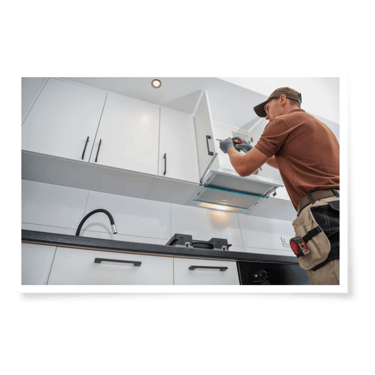 a man in a brown shirt installing an aluminum cabinet