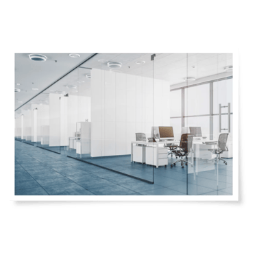 a large office with a glass wall partition and a computer desk