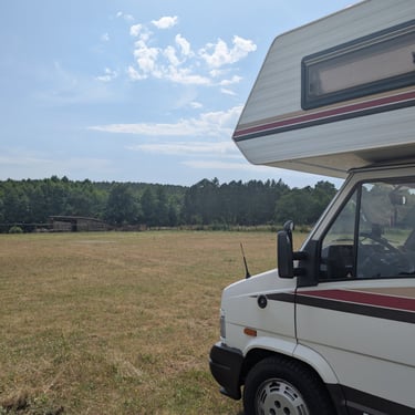 View of our clean camper setup at the new campsite