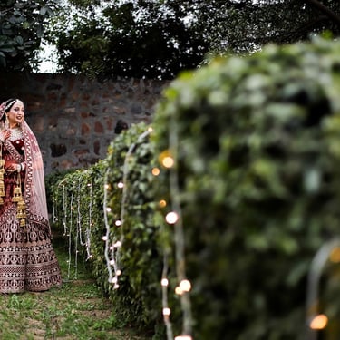 Bridal lehenga photography in a garden setting