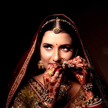 Close-up portrait of bride fixing her bridal jewellery