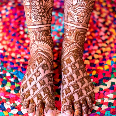 Bridal mehendi design on legs, close-up henna photography