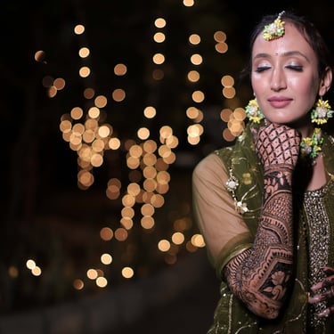 Bridal Mehendi ceremony photography with henna and jewellery detail