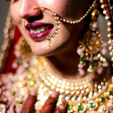 Close-up bridal makeup and jewellery detail photography