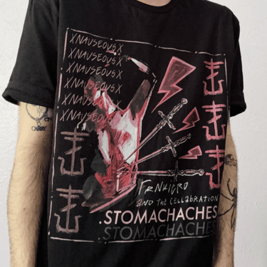 A photo of a person wearing a Stomachaches t-shirt. The shirt shows daggers pointing toward a man's stomach.