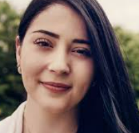 a woman with long hair and a white shirt