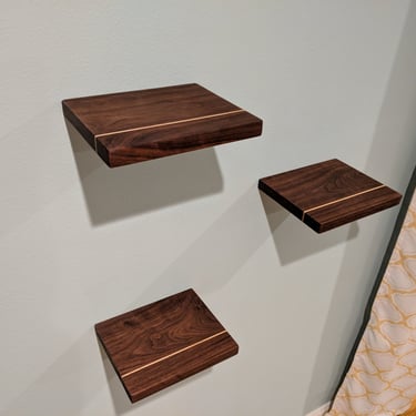 custom walnut floating shelves with maple band for bedroom