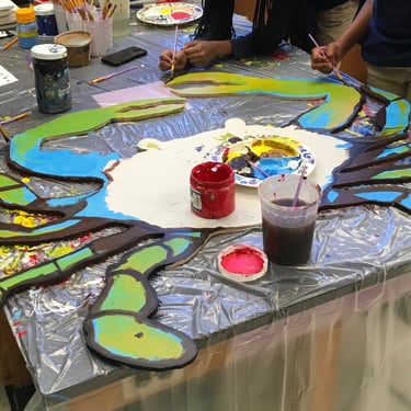 Eastport Elementary School students work on collaborative artwork with Arturo Ho