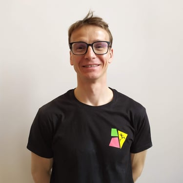 a man with glasses and a black shirt