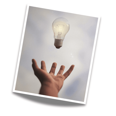inspirational photo of a hand and a light bulb