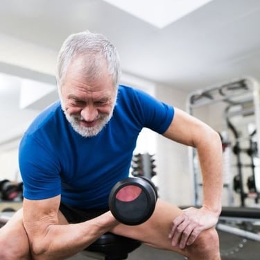 George Eleter holding a dumbble