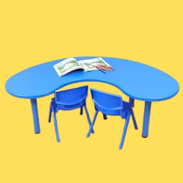 a blue table with a magazine and a magazine