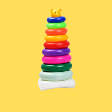 a stack of colorful plastic toys on a yellow background