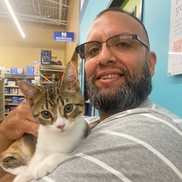 Ricardo hanging out with his kitty Pippy
