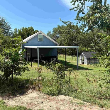 Metal Patio on a Grassy Area
