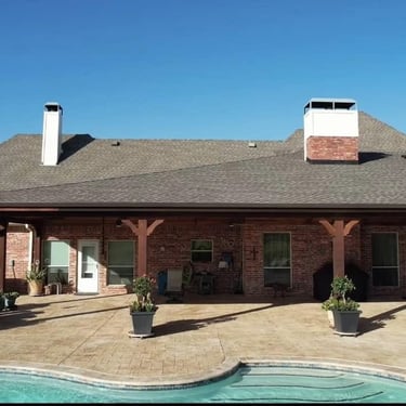 Bricked house extented covered patio.