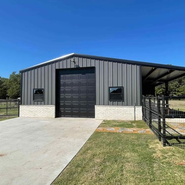 Metal Shop with Black Fence.