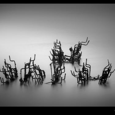 a group of chairs that are sitting in the water