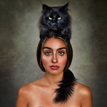 black cat sitting on a girl's head