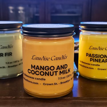 Three 9-oz soy candles sitting on a table
