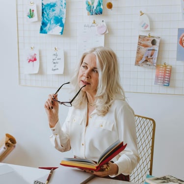 elderly woman thinking about why if she should invest in gold ira with augusta precious metals and the benefits they give