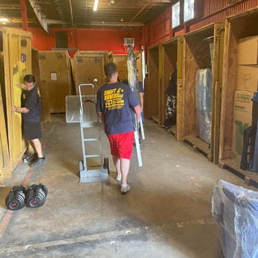 Swift Movers white glove crew in warehouse, trained and ready for high-value deliveries