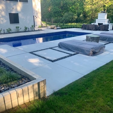 Leppek Landscapes designed and installed modern patio around in ground pool.