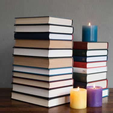 A happy customer browsing books in a charming, whimsical bookstore.