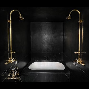 Black Tadelakt bathroom with gold fixtures - Greenwich Village - New York.