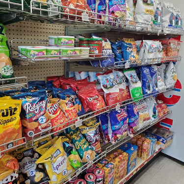 shelves showcasing different types of potato chips in colorful packaging