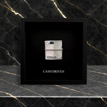 Frame with euro dollars folded for motivational, and sentence Cash Driven