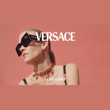 a woman wearing sunglasses versace and a necklace with a necklace