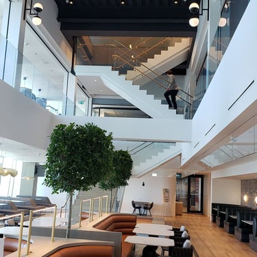 Second View of Ground Floor Lobby View of Metal Stairs with Wood Features, made by Pengelly
