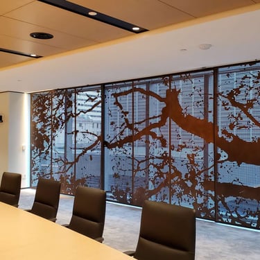 Wide view of laser cut tree bronze office boardroom screen by Pengelly Iron Works 